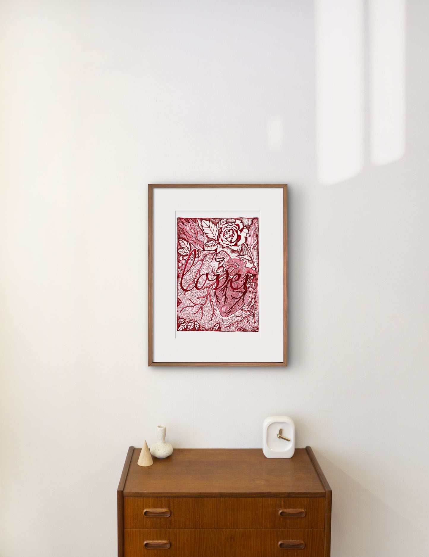 Lover written in the middle in red ink, behind drawing of pattern, biological heart, leaves, roots, and the kiss of two lips kissing each other, laurateodoriart